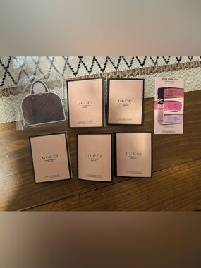 Gucci Rouge De Beauté Brilliant Lip Color sample cards, YSL, and car freshener